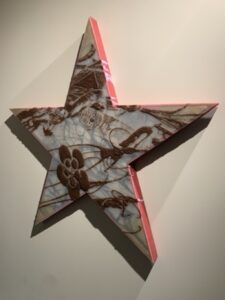 Star shaped wall object by ASMA, exhibited at PEANA gallery