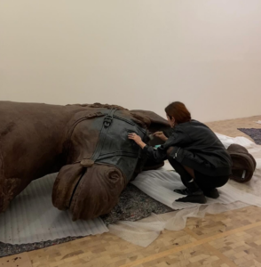 The artist Andrea Ferrero preparing her installation at Museo Tamayo