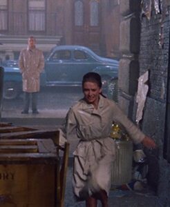 Iconic "Breakfast at Tiffany's" rain scene with Holly looking for her cat.