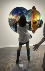 Standing in front of a work by Olafur Eliasson at Tanya Bonakdar's booth at Frieze 2025.
