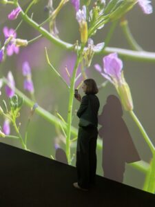 Linda in front of Cauleen Smith's installation "The Wanda Coleman Songbook".