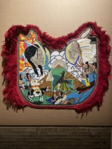 Work made of glass beads and rhinestones, velvet and feathers, by Big Chief Demond Melancon.